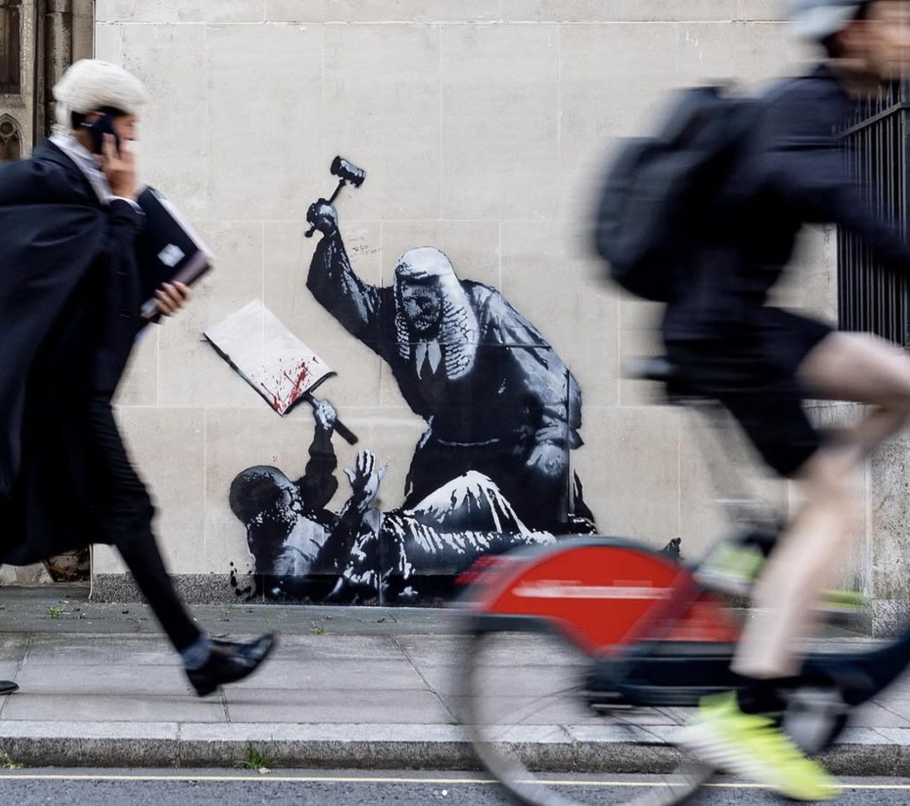 Banksy Creates Mural Depicting Judge Assaulting Protester Following Mass Arrests in London Banksy Creates Mural Depicting Judge Assaulting Protester Following Mass Arrests in London