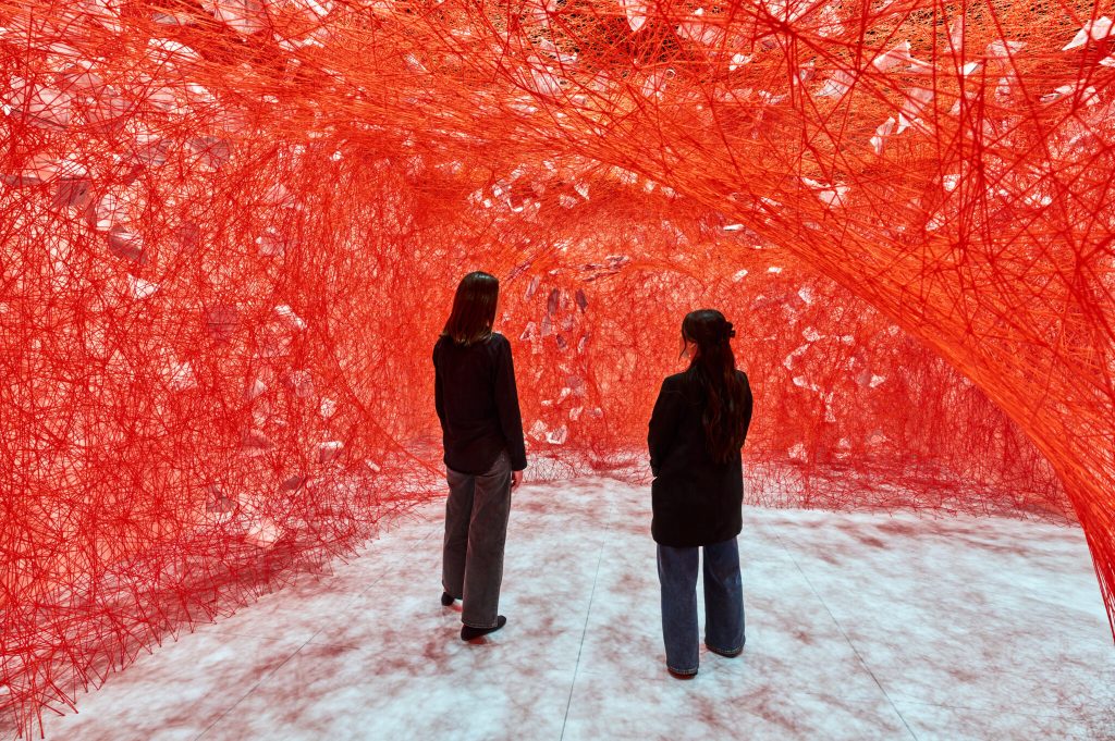 Chiharu Shiota’s Latest Exhibition Wraps Guests in a Complex Red Thread Cocoon Chiharu Shiota’s Latest Exhibition Wraps Guests in a Complex Red Thread Cocoon