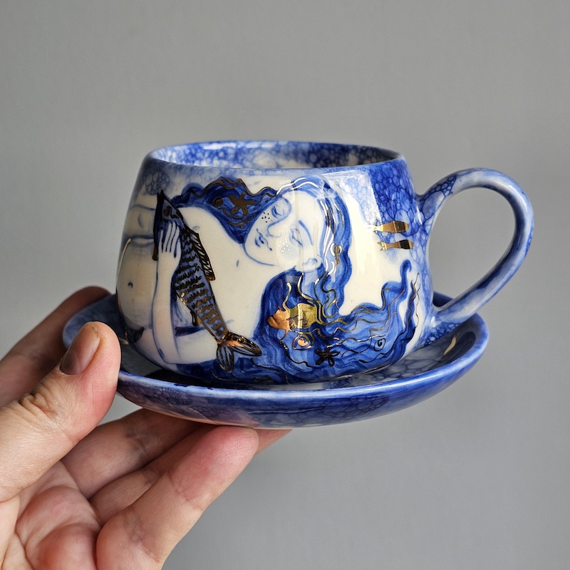 Handcrafted Ceramics Showcasing Mermaids Adorned with Golden Highlights