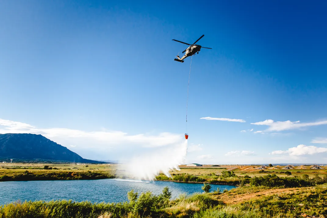 3 - Black Hawk pilots at Fort Carson practice with Bambi Buckets, designed to transport water for combating large fires.