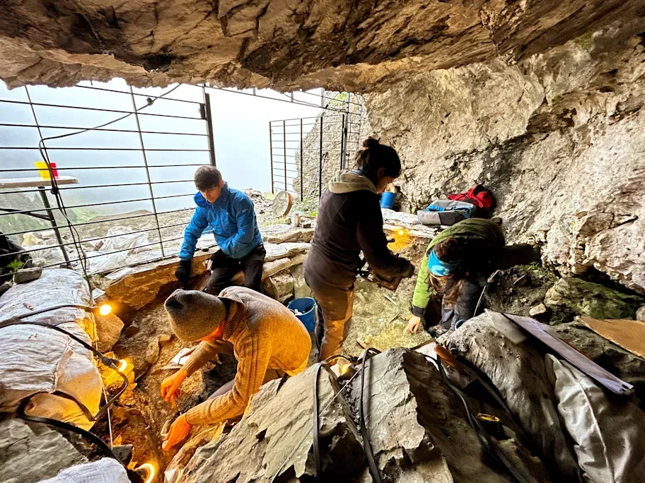 People excavating cave